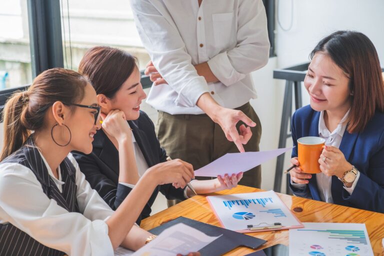 Group Of Financial Team In Business Casual Analyzing Financial D